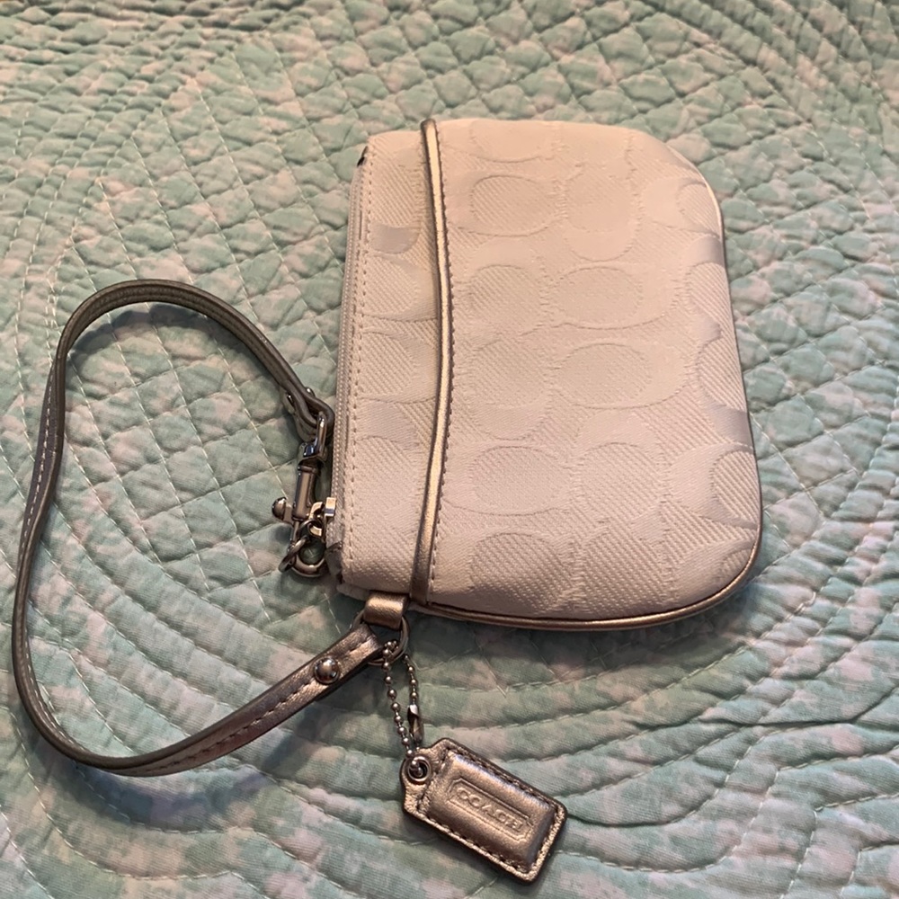 Coach wristlet white/silver piping and hand strap